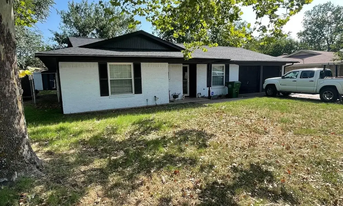 Professional roofing crew working on a residential roof in Antioch